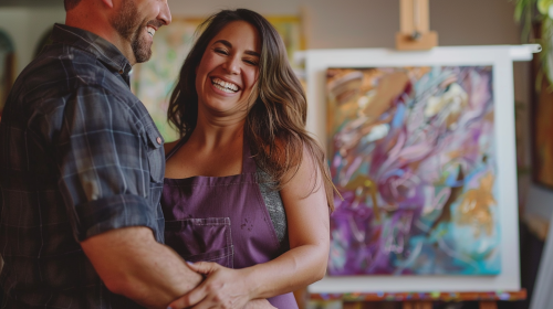 Woman painting with husband hug Woman painting with husband hug
