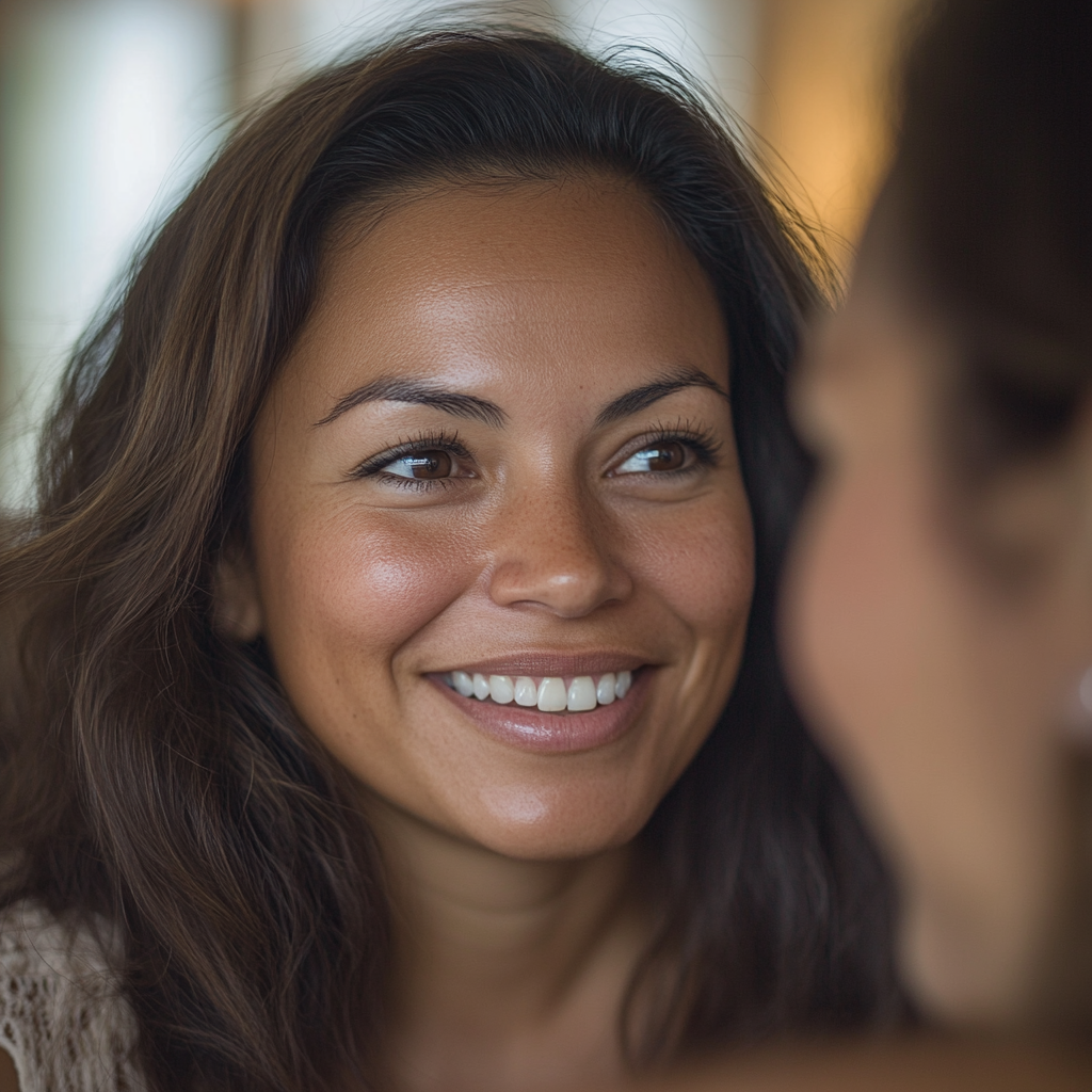 A Calm Latina Woman Smiling With Friend