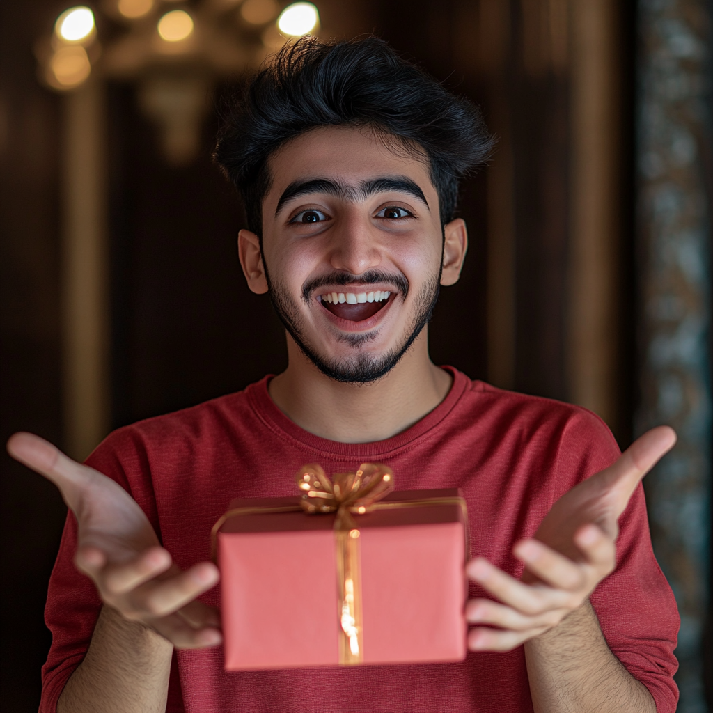 Excited Arab young man holding mystery gift happily.