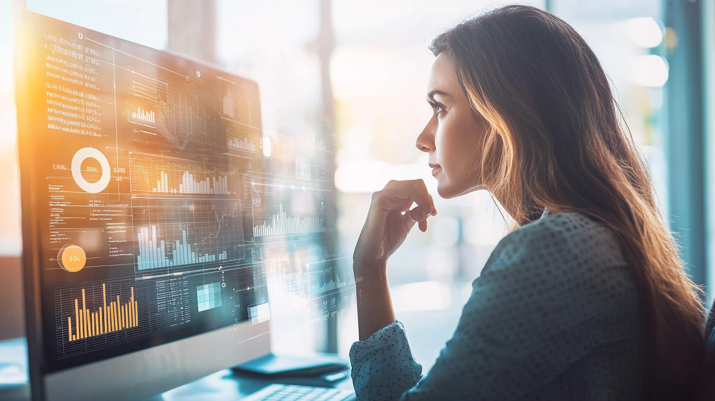 Financial Executive Analyzing Data on Computer Screen.