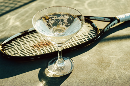 A Fancy Martini on Tennis Court in Afternoon