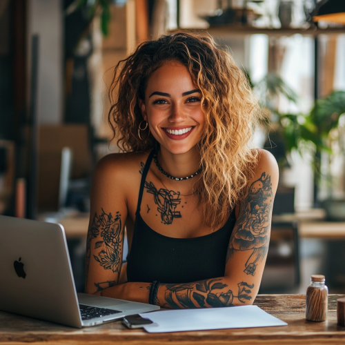 A Freelance Copywriter with Tattoos Smiling in Office