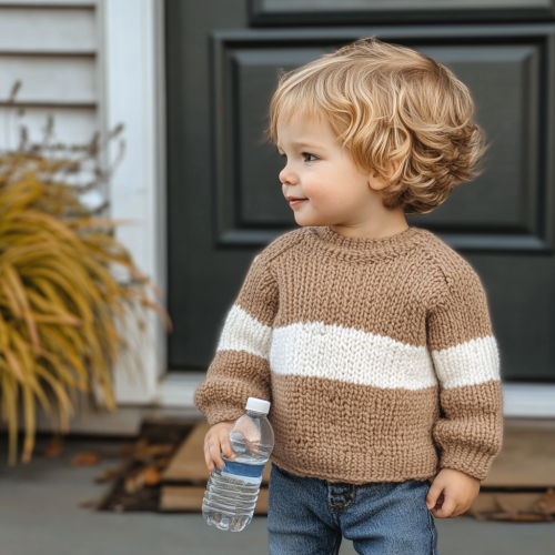 A Toddler Boy in Brown Sweater on Porch