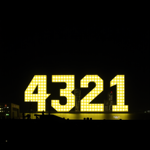 A colorful abstract painting with numbers and shapes.