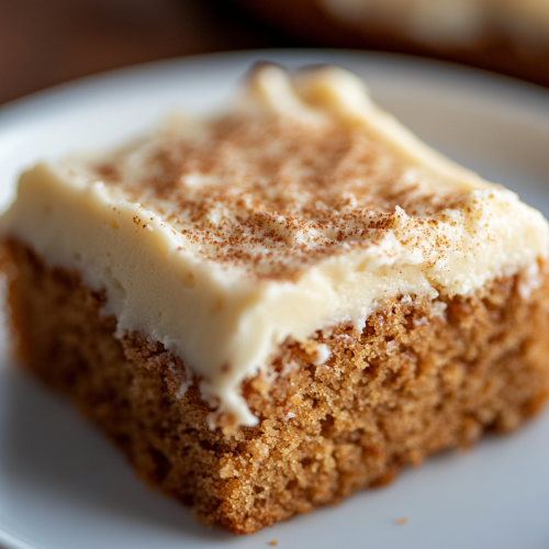 Applesauce Cake Slice with Vanilla Frosting Warm Lighting