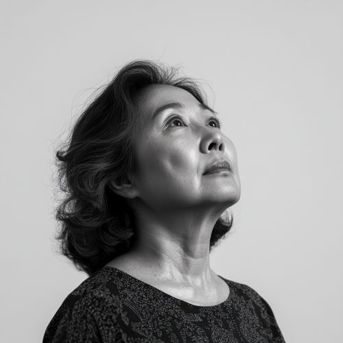 Confident 59-Year-Old Asian Woman in Black and White