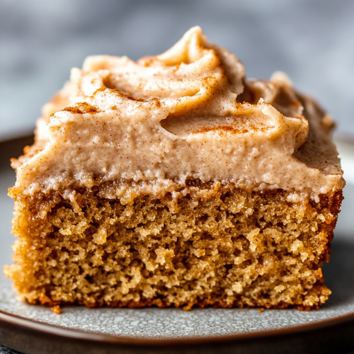 Moist Applesauce Cake Slice with Creamy Frosting