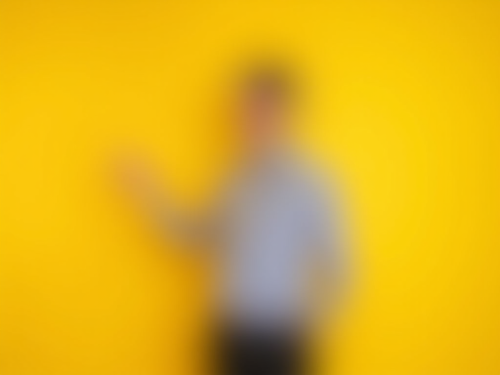 Sales Rep Presenting Product on Yellow Background