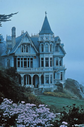 Shorecliff Manor Victorian house with blue shutters, tower, widow's walk.