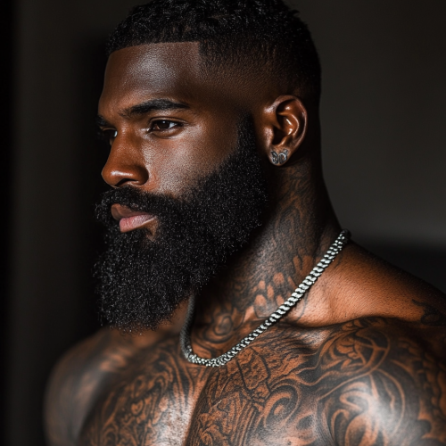 Tall black man with sharp haircut, tattoos, muscular body.