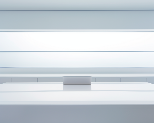 Empty white desk with blank computer monitor