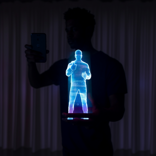 Translucent hologram of a man on a smartphone Translucent hologram of a man on a smartphone