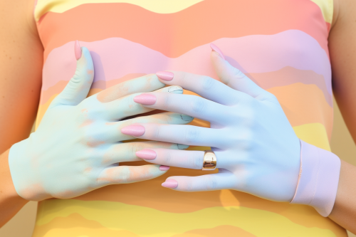 Hand with rainbow veins and long painted claws Hand with rainbow veins and long painted claws