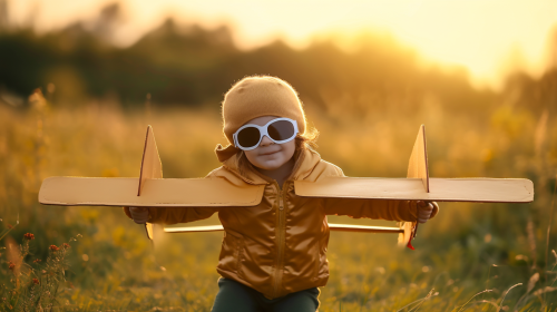 happy child playing outdoors homemade plane costume