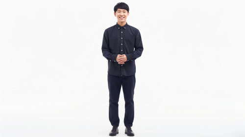 Korean man smiling in navy shirt and slacks