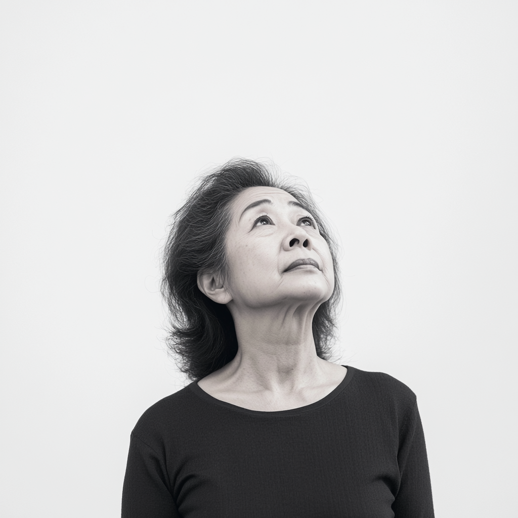 59-Year-Old Asian Woman in Black and White Portrait 