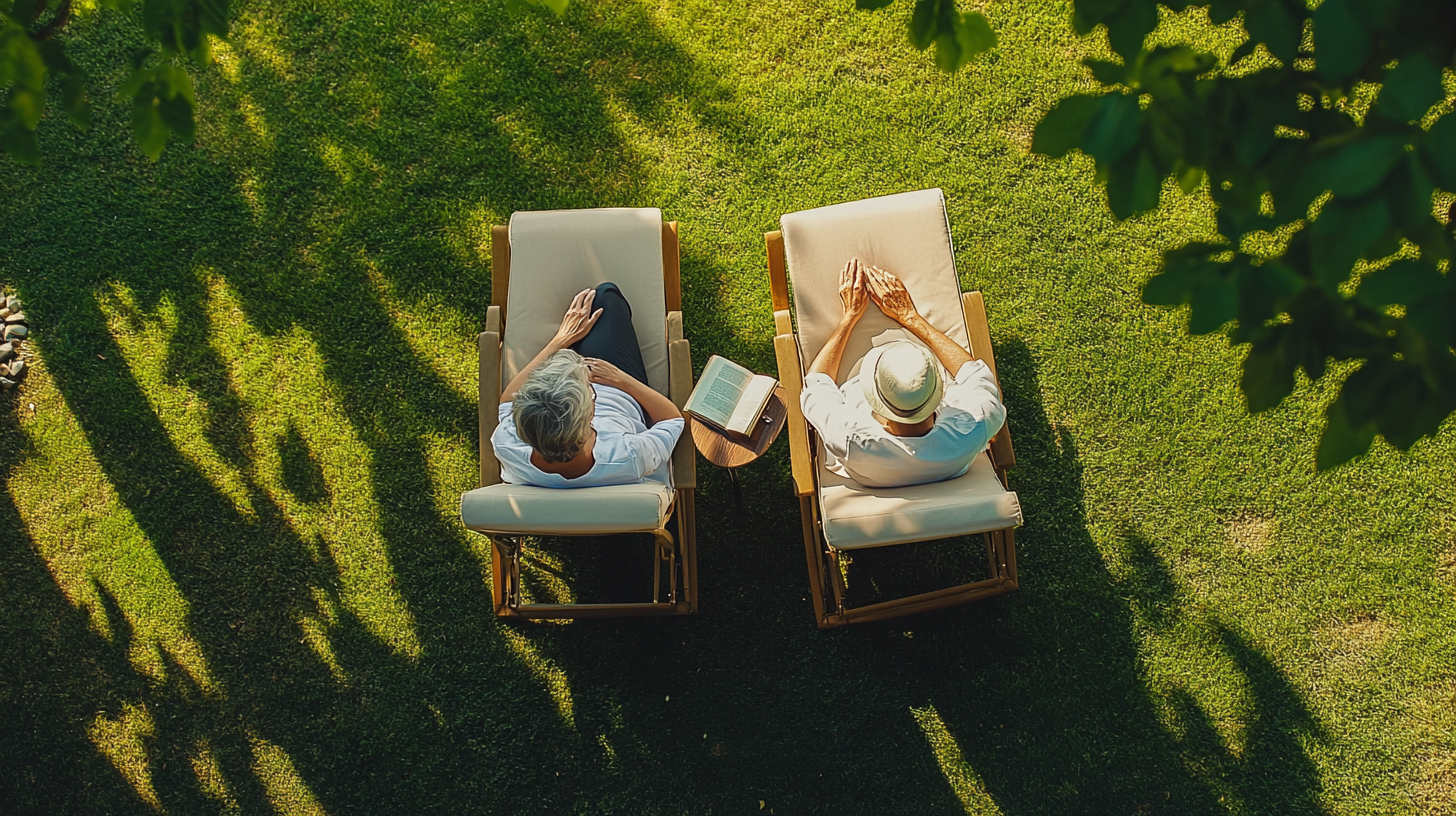 A Couple Reading in Garden Recliner Chair.