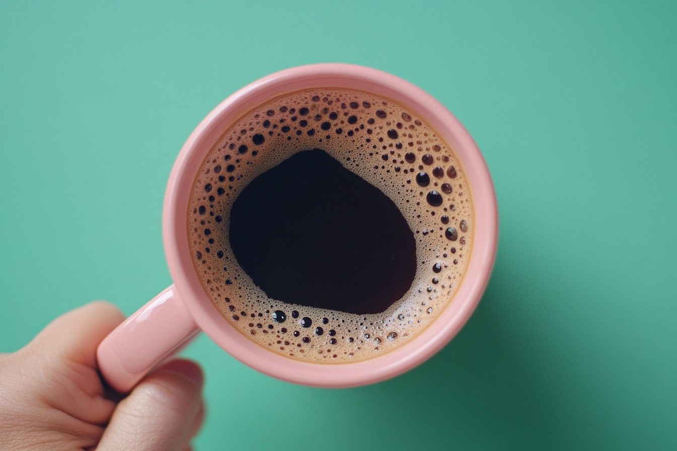 A happy coffee mug on a green table