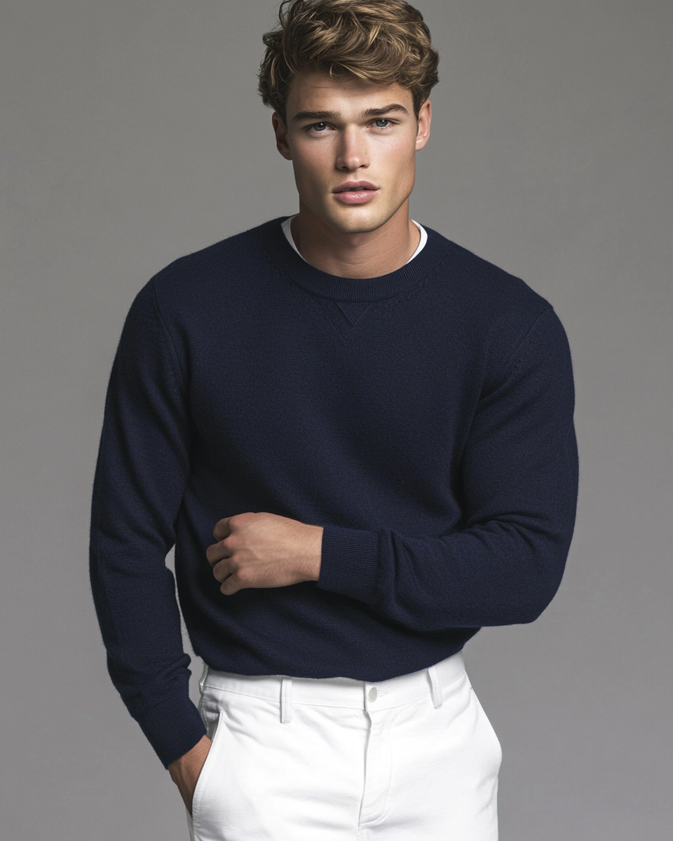 A man in blue sweater and white pants