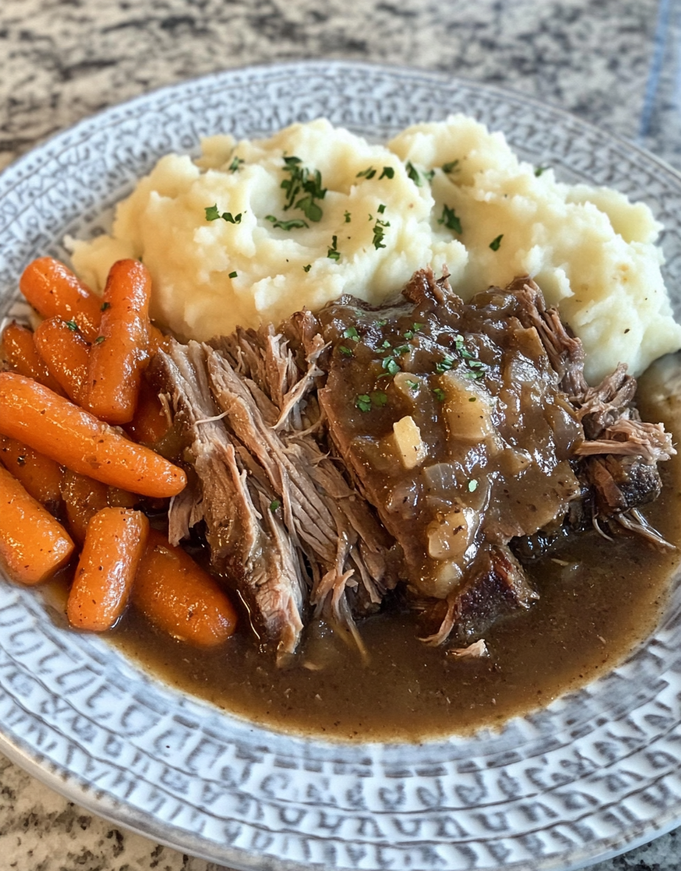 Amateur photo of pot roast with gravy and vegetables.