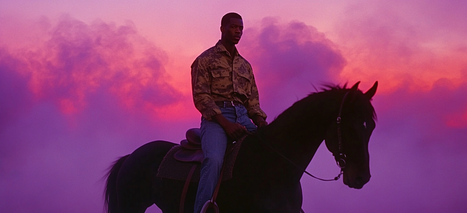 An African American Man Riding Black Horse