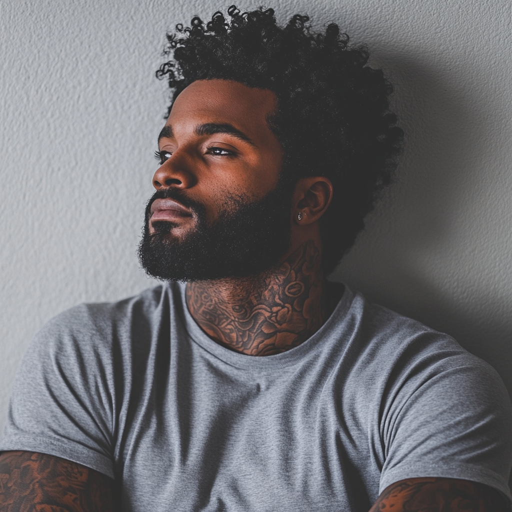 Athletic Black Man with Tattoos and Afro