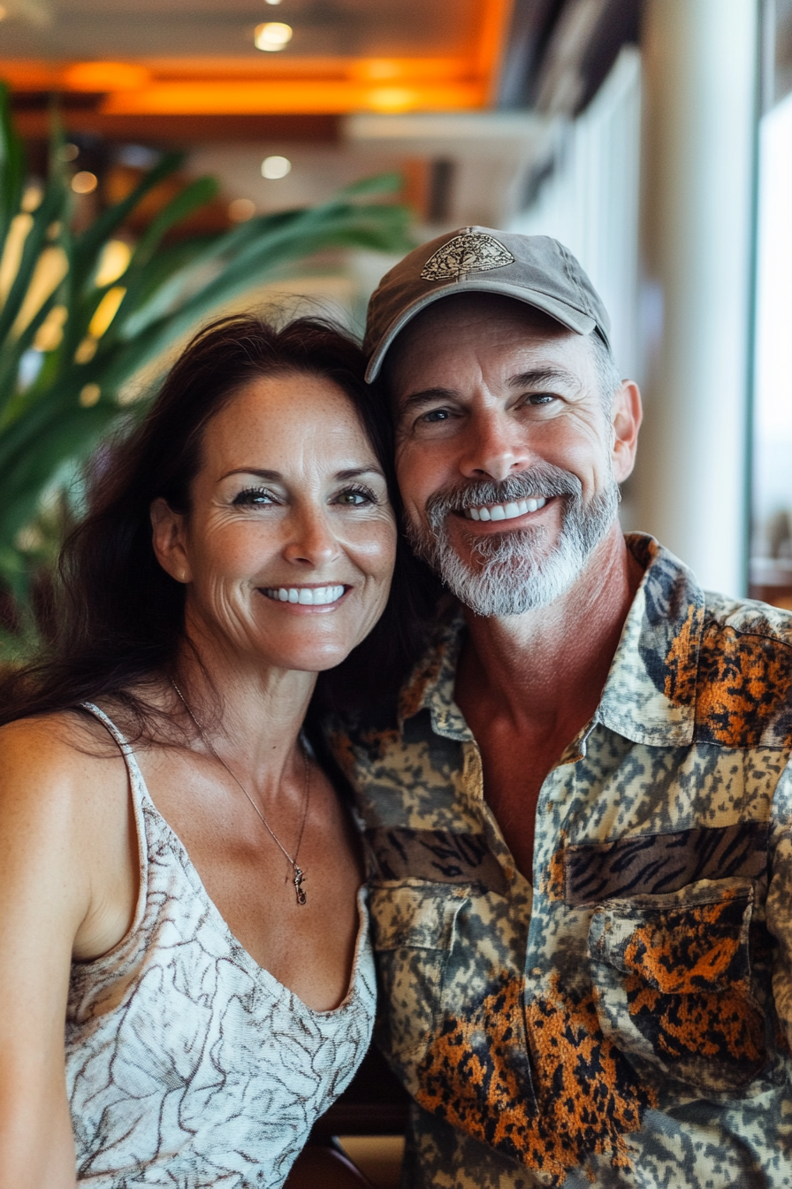 Beautiful couple smiling in dark cruise ship restaurant