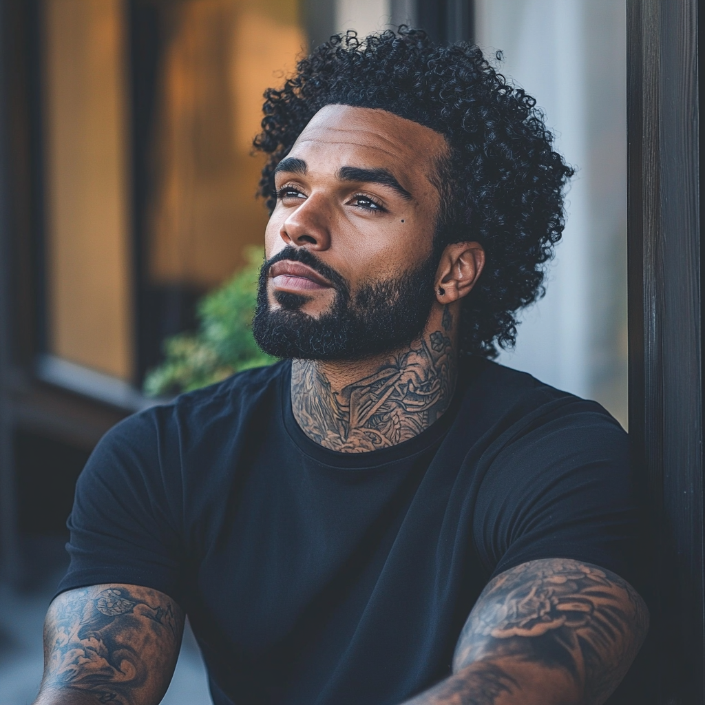 Black man with detailed neck tattoos outdoors