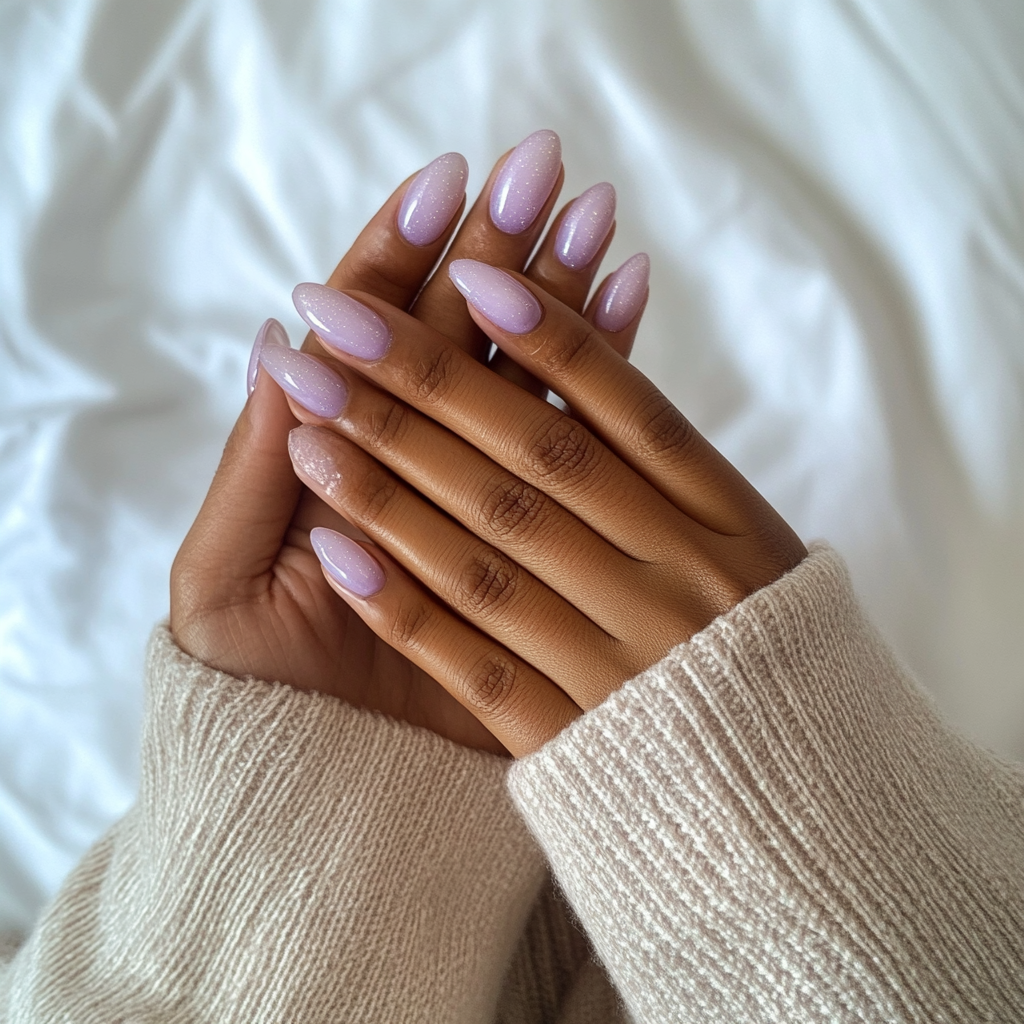 Candid photo of woman showing off lavender nails.