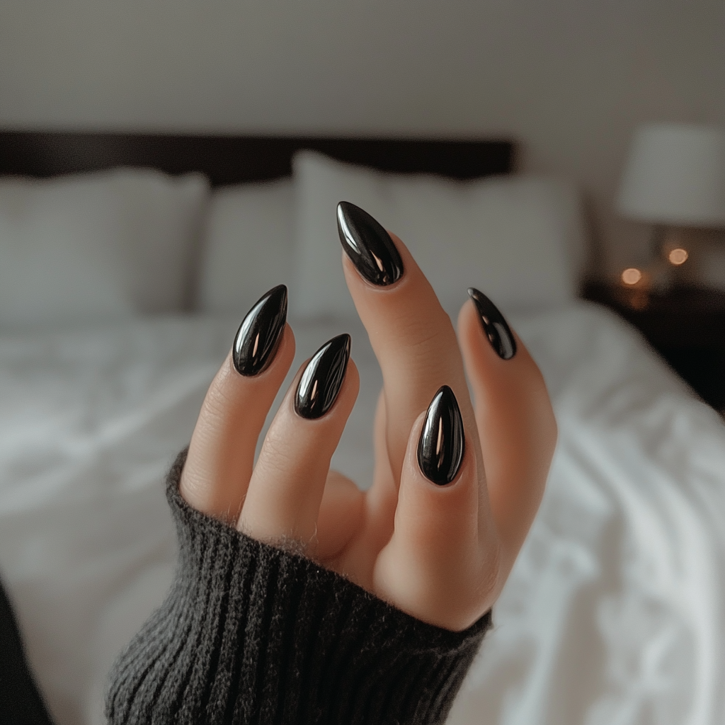 Candid white woman shows off round black nails.