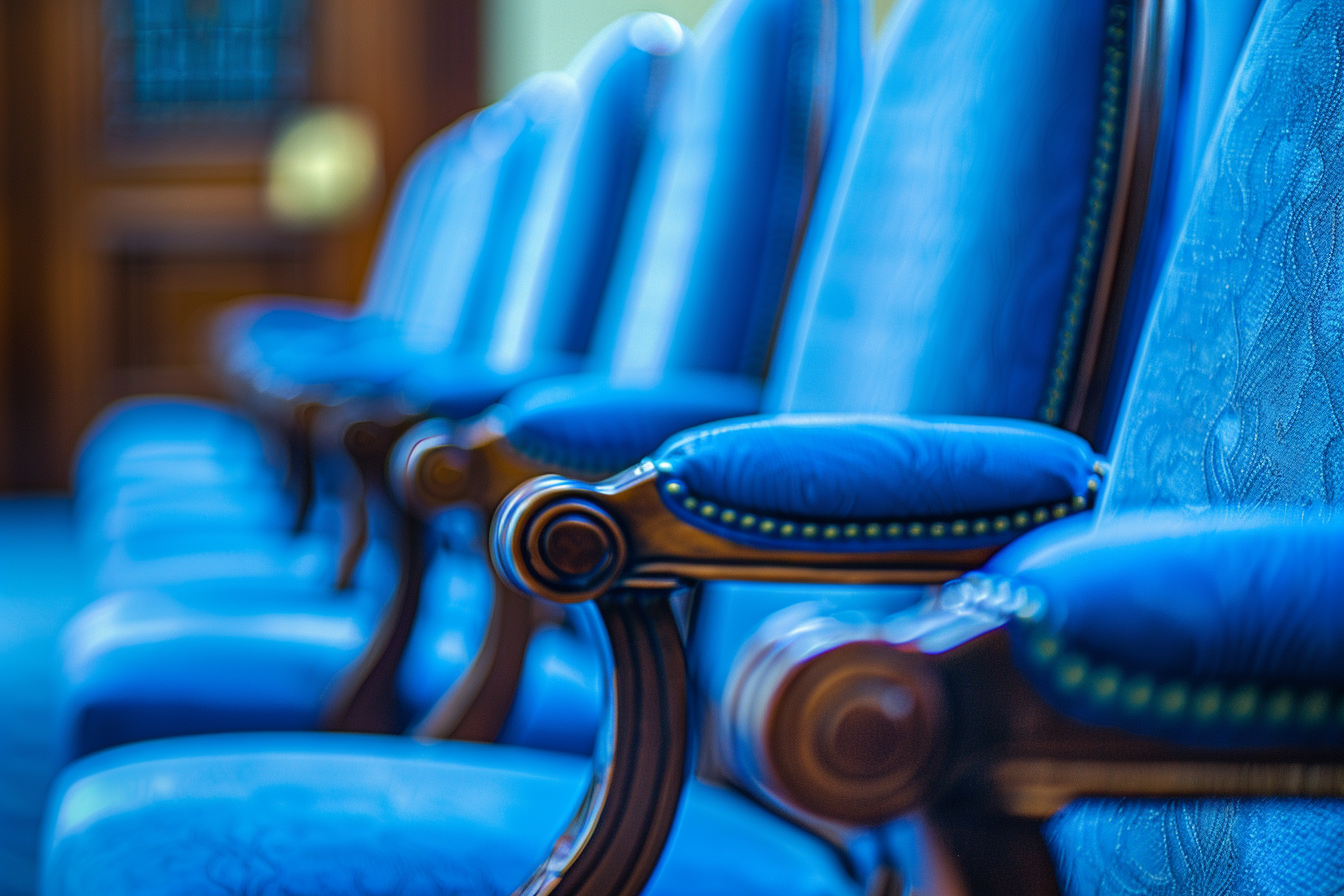 Clean blue seats in orderly auditorium under soft light