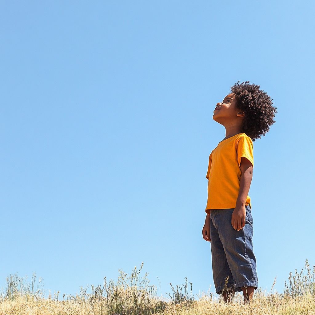 Confident Black child in vibrant, limitless sky scene.