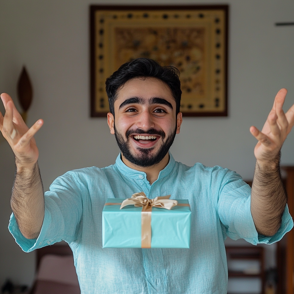 Excited Arab young man holding mystery gift happily.