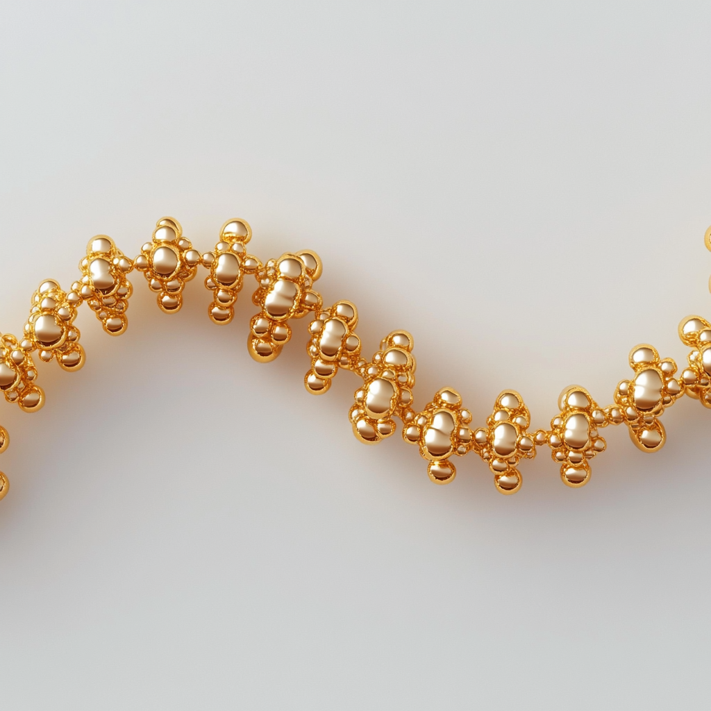 Golden garland made of small round beads on thread.