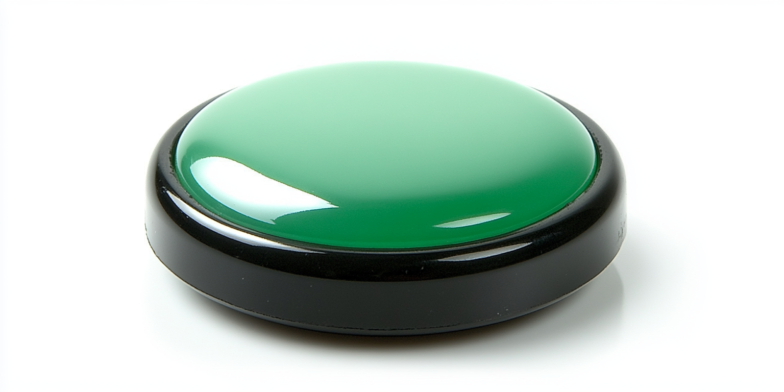 Green glowing button on black base, angled left.