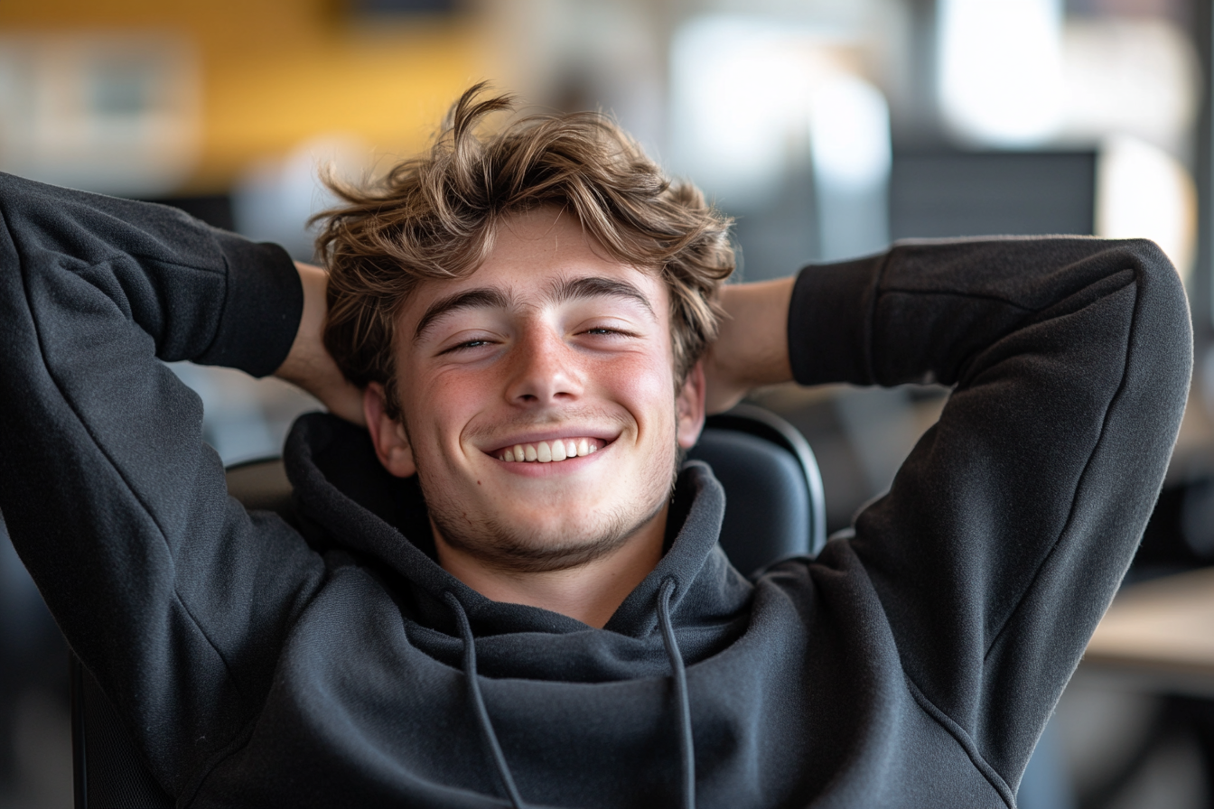 Happy man in office, Nikon D850, photojournalistic style.