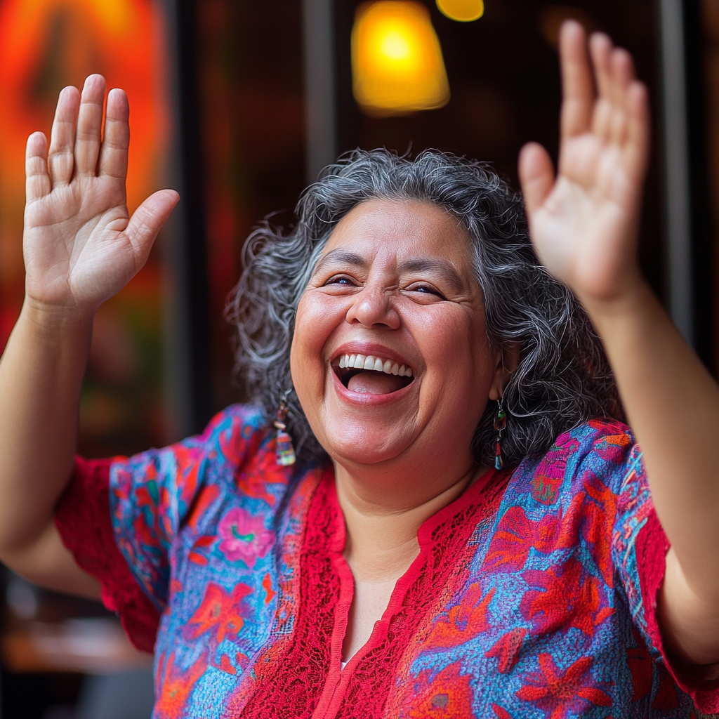 Middle-aged Mexican woman smiling after small victory. Excited, playful.