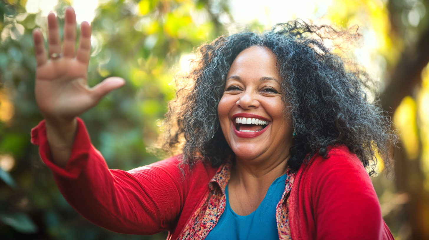 Middle aged woman joyfully celebrates small win with high-five.