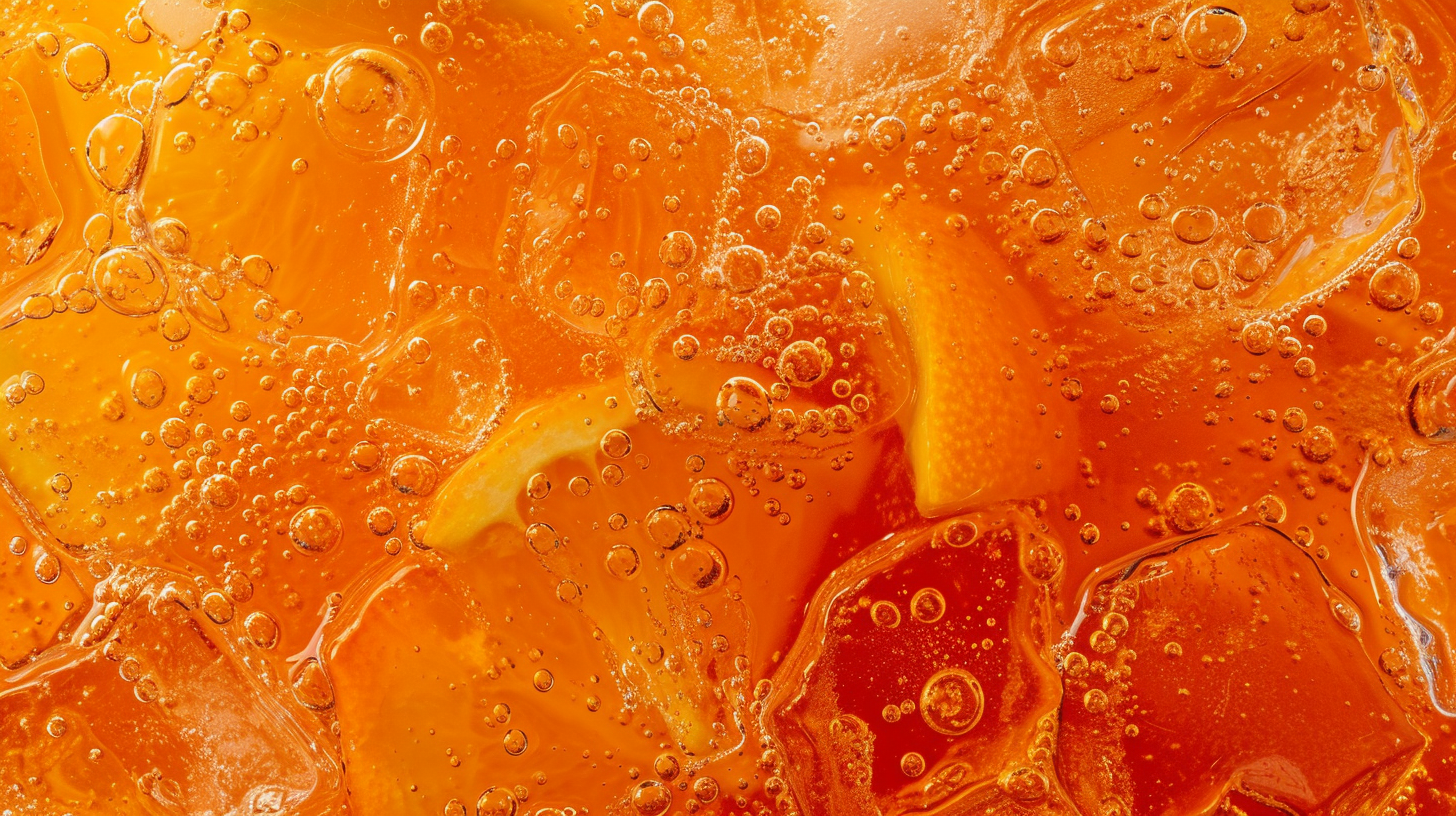 Refreshing Orange Fanta Drink with Ice and Oranges