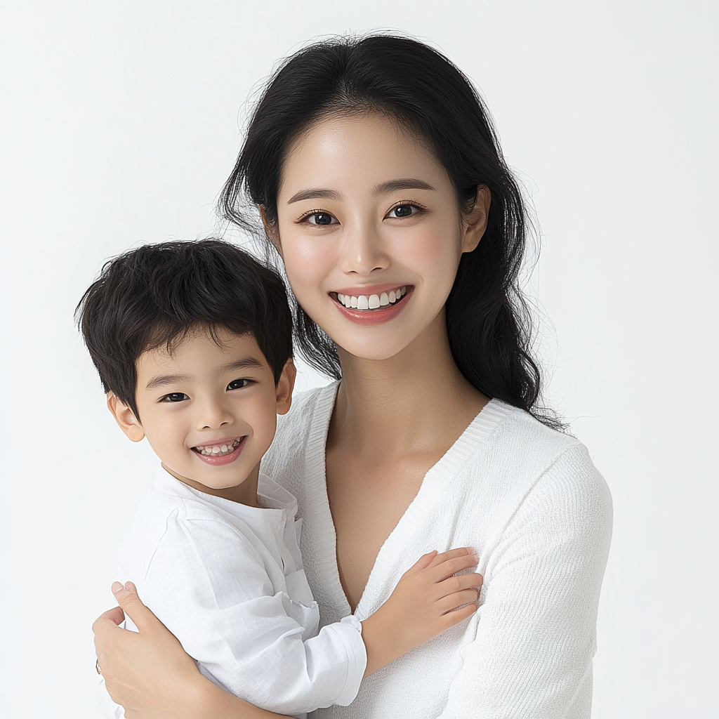 Young Korean woman, confident smile, white background, with son.