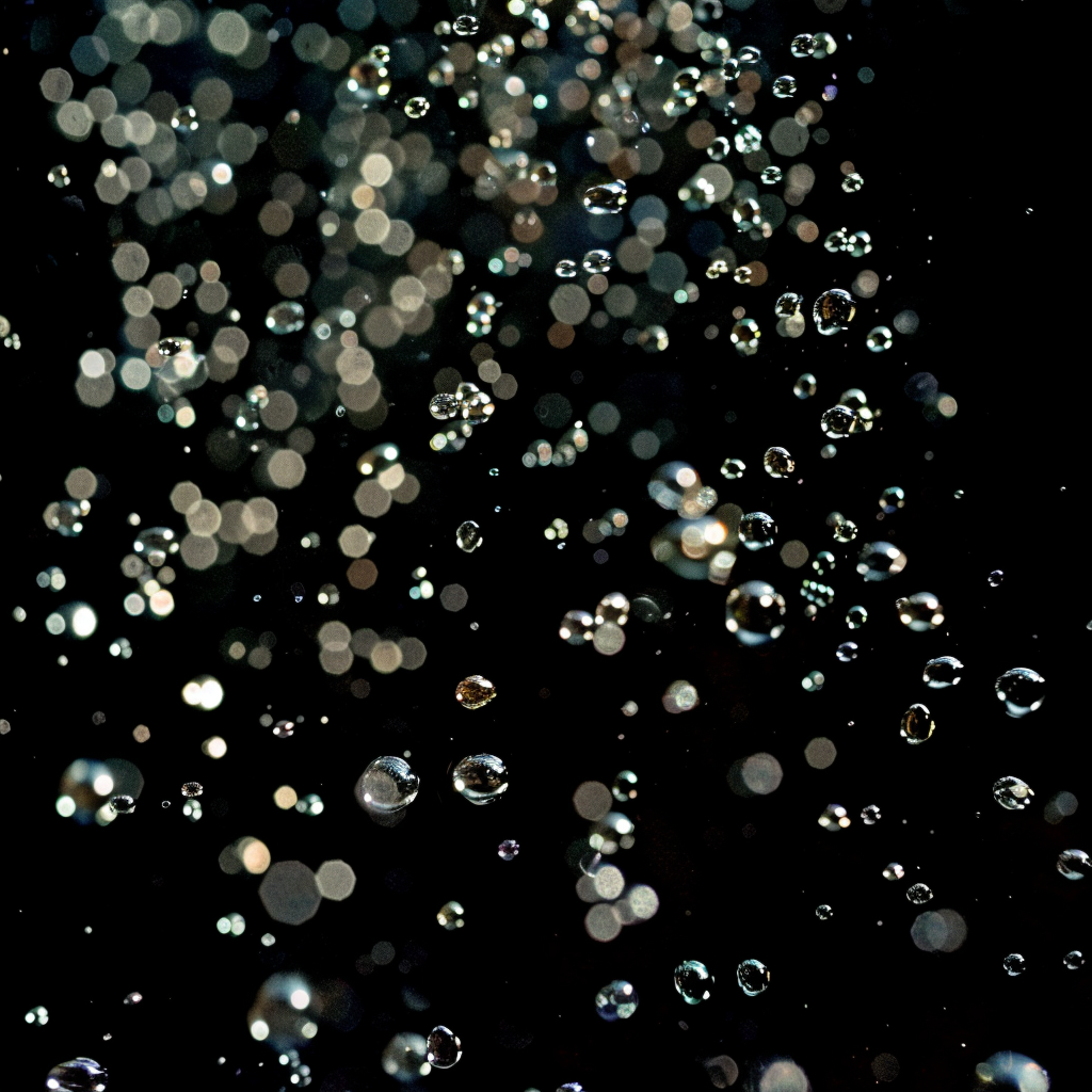 Sparkling water bubbles on black