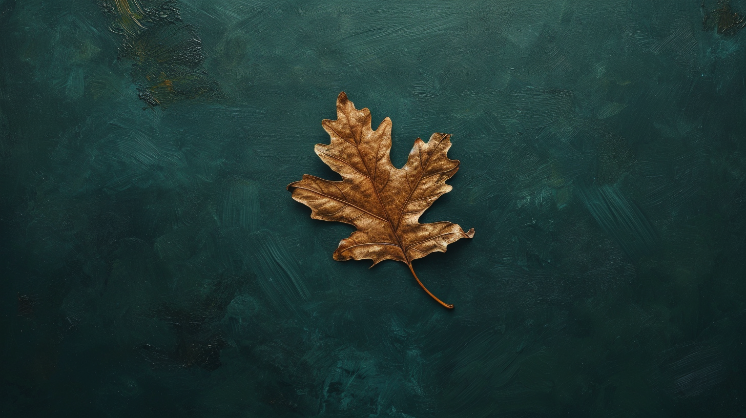 Golden oak leaf falling on dark green background