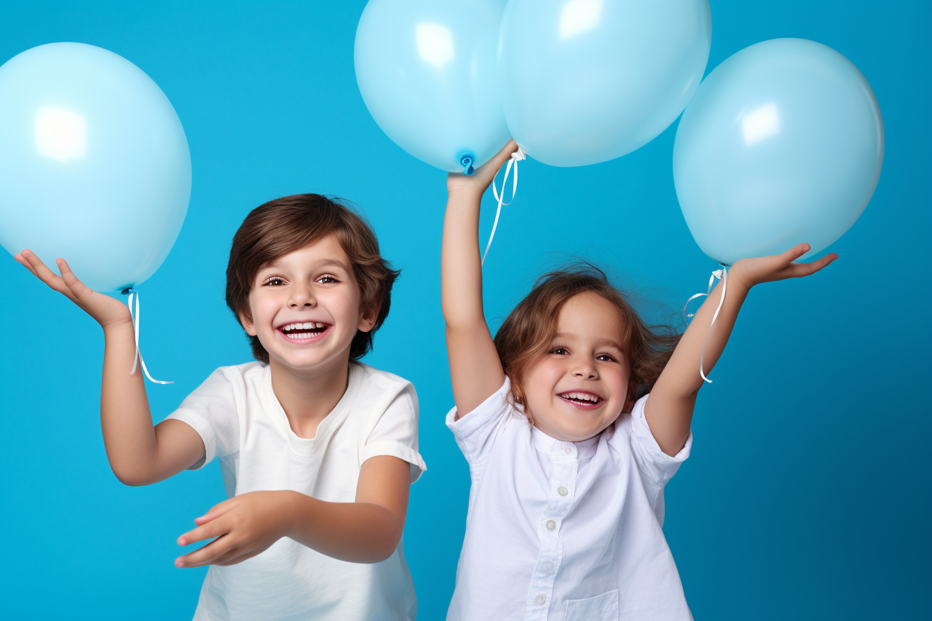 Two happy kids playing with colorful balloons