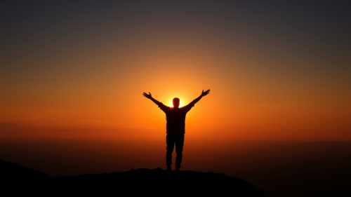 A Person Celebrating the Sunrise Alone