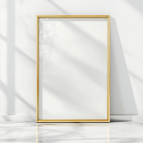 A gold frame on white wall awaits photo