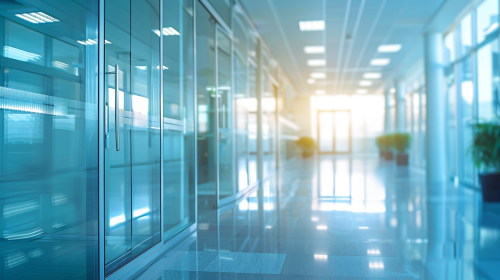 A realistic photo of a bright glass office