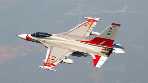 A sleek fighter jet soaring in the sky.