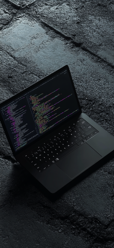 A stylish laptop showing code snippets on screen