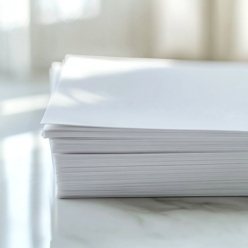 Clean paper stack in minimalistic setting, creating professional atmosphere.
