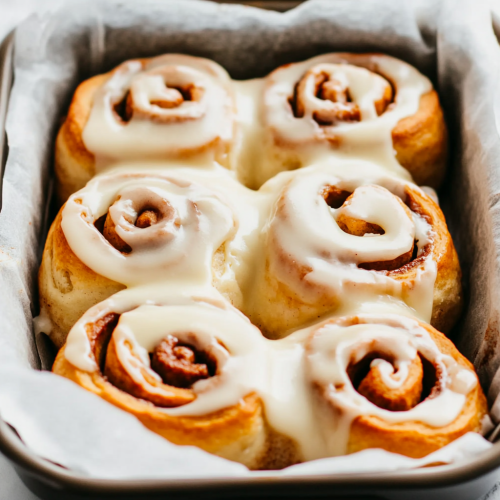 Delicious cinnamon rolls covered in creamy vanilla icing